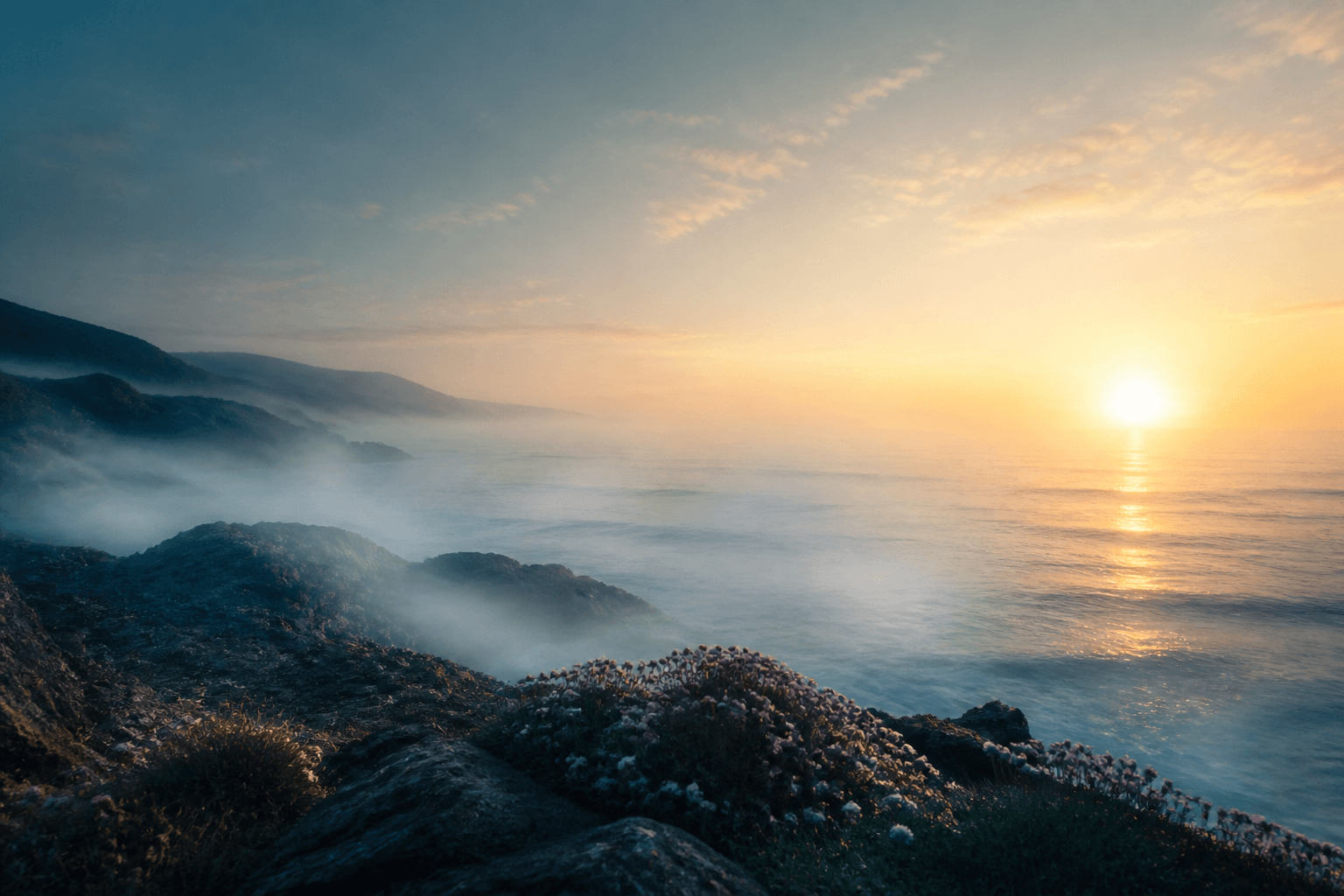 Soft dawn light over a calm ocean horizon, suggesting hope and renewal